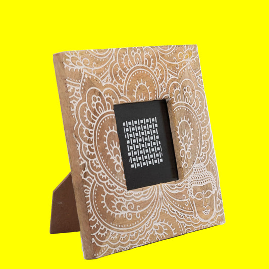 Decorative photo frame with mandala design on a white background