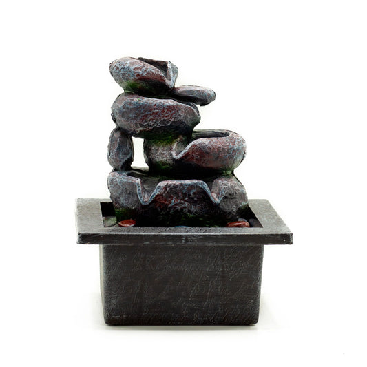 Decorative stone fountain on a white background